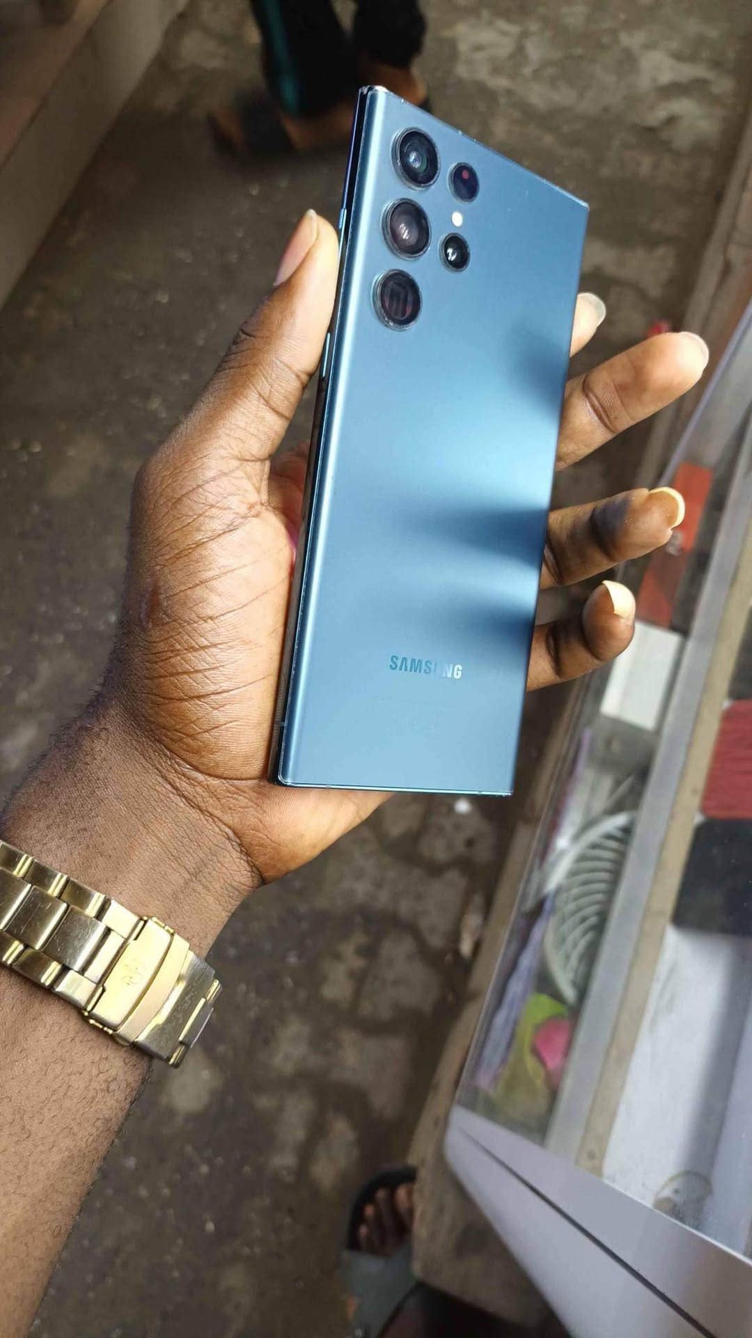A picture of Samsung s22 ultra slight cracked screen at the top left