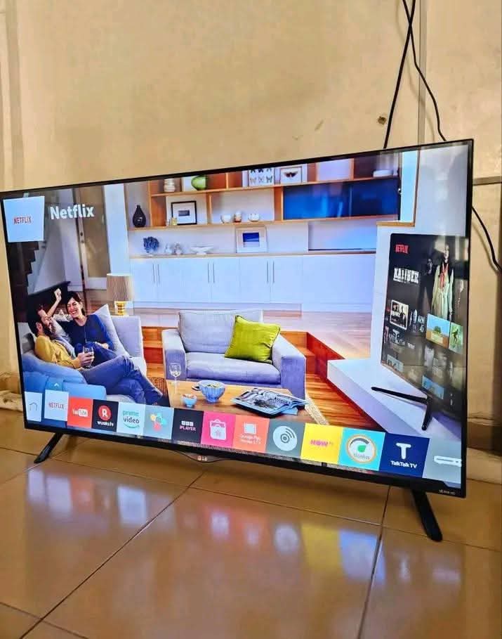 A picture of 70inch LG frameless smart TV 4k with phone WiFi network
