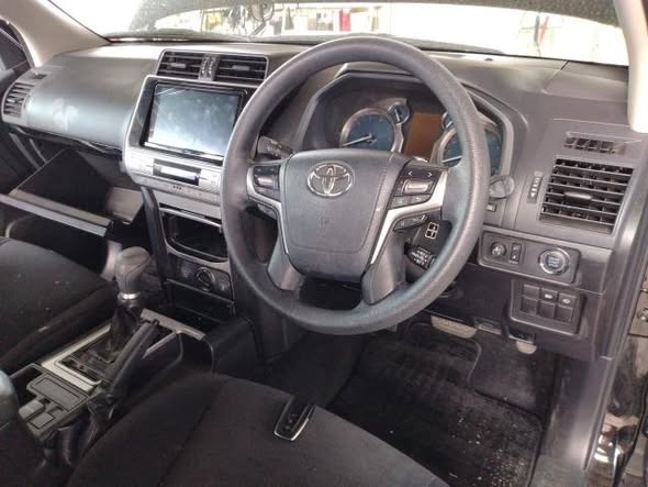 A picture of DAMAGED TOYOTA LANDCRUISER PRADO PETROL READY TO BE IMPORTED UGX30M