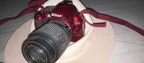 A picture of Camera Nikon d3100 Made in Thailand Excellent condition Lens 55