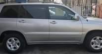 A picture of Distress sale Toyota Highlander 2005 model with 4 plugs engine
