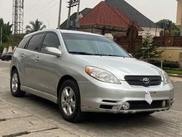 A picture of SHARP TOYOTA MATRIX 2004 MODEL HAS A PANO ROOF AT