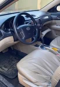 A picture of Clean Nigerian Used White Kia Optima 2009