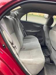 A picture of Pepper red 2010 Corolla Le available Abuja used owner 7m