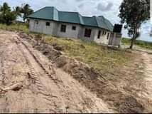 A picture of CHAMAZI MBANDE REAL ESTATE INAWALETEA MILIKI KIWANJA KWA LAKI300 000