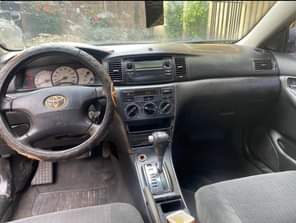 A picture of Sharp buy and drive 2004 Toyota Corolla with nothing to
