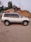 A picture of Rav4 milango mitano ipo Mbezi mwisho imepoa Bei mil 11