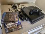 A picture of PS4 WITH 5 GAMES 1 CONTROL AND 2 MIC