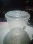 A picture of Flampen charcoal stove a bucket