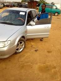 A picture of Mazda 323 for sale direct Belgium 3months used everything is