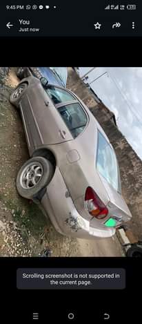 A picture of Toyota Corolla LE year 2004 engine and transmission and ac