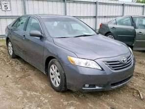 A picture of Nigeria custom services auctioning Cars bags of rice and vegetable