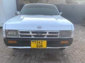 A picture of Nissan pickup full Ac manual transmission petrol new tires million