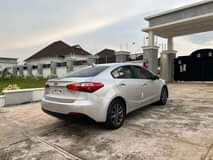 A picture of NEATLY USED 2014 KIA CEREATO WITH DUTY AND COMPLETE PAPERS