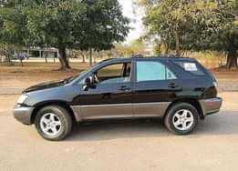 A picture of Lexus RX300 for sale everything working perfectly fine at an