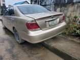 A picture of DISTRSS SALE 2004 model toyota camry LE BIG DADDY painted