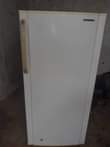 A picture of Samsung single door fridge with a big freezer with a