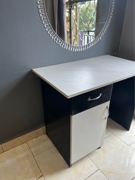 A picture of 5 6 Metalic wood bed and dressing table on sale