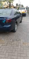 A picture of Toyota Corolla 2007 model very sharp painted engine and gear