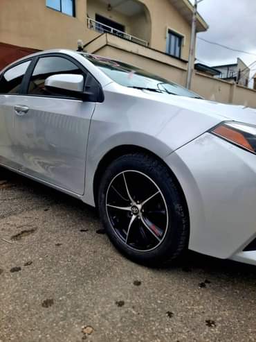 A picture of NEW ARRIVAL FOREIGN USED 2014 COROLLA With Rev Camera Bluetooth