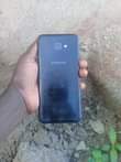 A picture of Samsung galaxy j4 core imenyook ukung kwa mbal camera ya