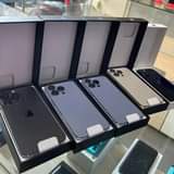 A picture of Used phones and brand new boxed phones