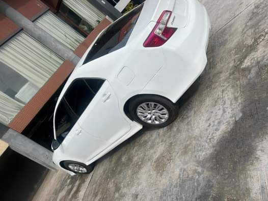 A picture of 2013 MODEL TOYOTA CAMRY LE FOR SALE AT ABUJA 8