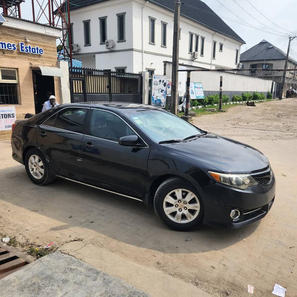 A picture of A well used 2013 camry with engine gear ac intact.