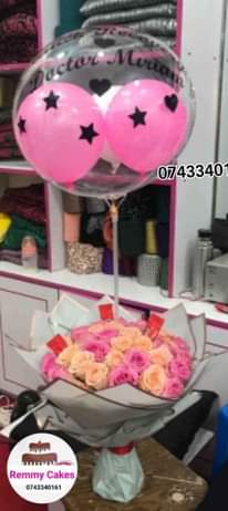 A picture of  flowerbouquet moneyhampers balloons cakes surprisepackages gifts deliveryavailable kampalaUg
