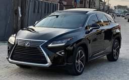 A picture of Toks Premium trim lexus rx350 year 2017 olour Black Tan