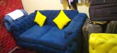 A picture of Sewing machine for sweaters and designs fan sofa set upha