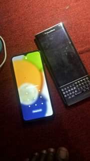 A picture of Samsung A03 with a pattern. Black berry priv with no
