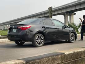 A picture of Toks standard 2015 corolla sport 2020 on custom Carefully driven