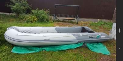 A picture of PVC inflatable boat 10 people in need of repair