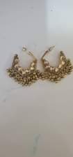 A picture of Jhumka and cosmetic