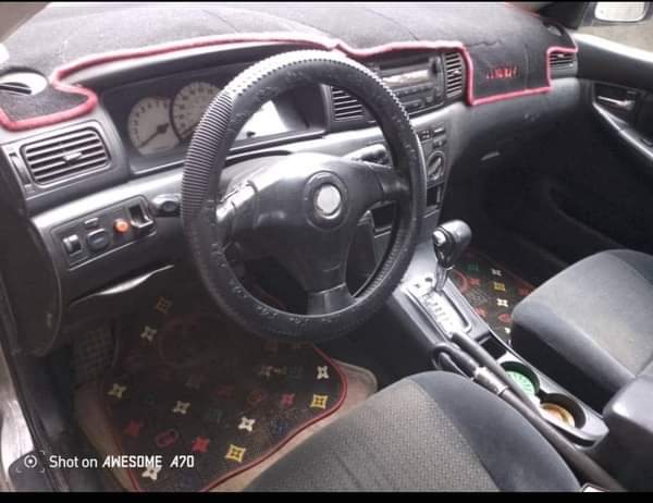 A picture of TOYOTA COROLLA 2004 ENGINE 85 GEAR AC BODY NEEDS LITTLE