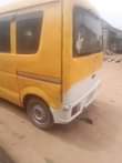 A picture of Susuki Mini Bus currently plying the road with gear that