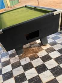 A picture of 8ft normal table foreign snooker table with 10coin and use