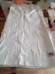 A picture of VEST NZITO PLAIN WHITE JUMLA