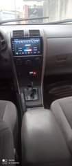 A picture of Toyota Corolla model 2010 engine gear box AC chilling clean