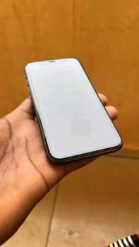 A picture of iPhone 11 for sale coming with the complete accessories 256