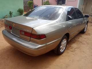 A picture of Toyota Camry pencil light untampered engine and gear sweet interior