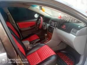 A picture of TOYOTA COROLLA 2004 MODEL WITH SHARPEST INTERIOR AND INDOMIE RIMS