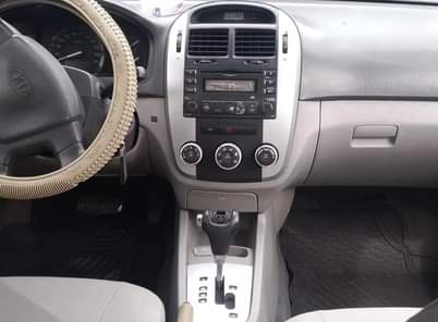 A picture of Kia cerato 2008 Engine has small top noise AC is