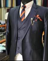 A picture of We do custom made suits PESHS CLOTHING HUB KAMPALA