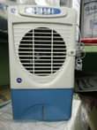 A picture of AIR COOLER KAMA AC Unaweka maji Zinatoa baridi kama AC
