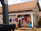 A picture of Nanganda kansanga rd plot starts with tarmac