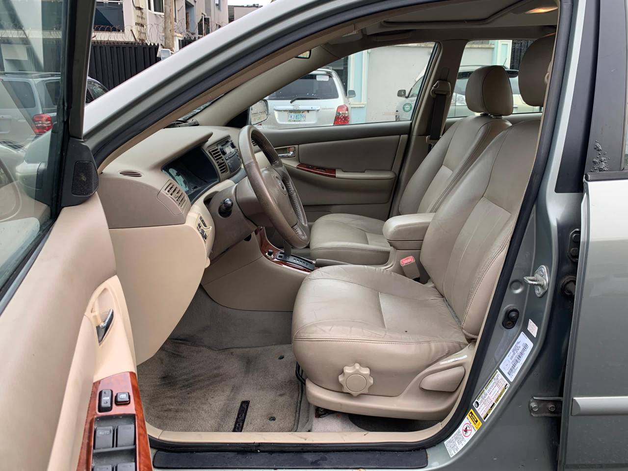 A picture of 2004 Toyota Corolla LE leather seats Open Roof Super clean