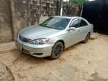 A picture of NIGERIA USED TOYOTA CAMRY 2004 model smoking engine and good
