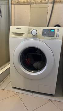 A picture of Washing machine storage printer and kids feeding chair water dispenser